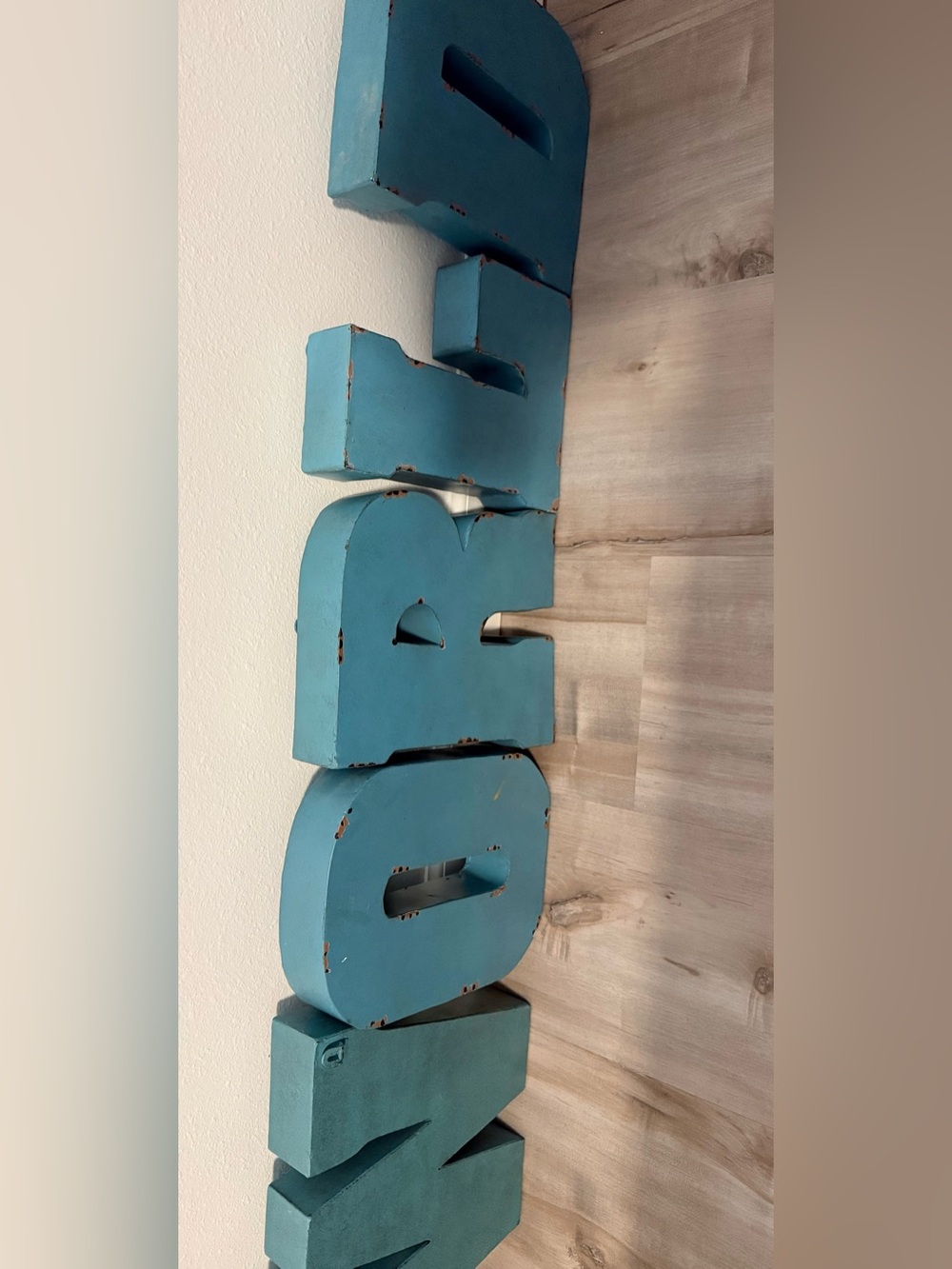 Vintage teal metal channel letters distressed industrial wall WORLD"